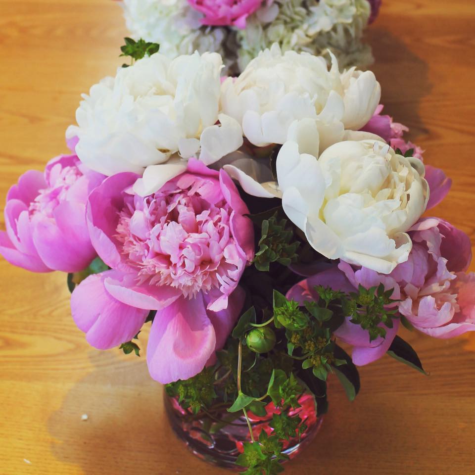 Locally grown pink and white peonies accented with bluporum and hot pink gem stones