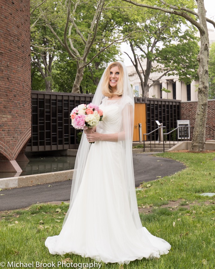 Lisa with her bridal bouquet in front of the MIT Chapel. Photo by Michael Brook Photography