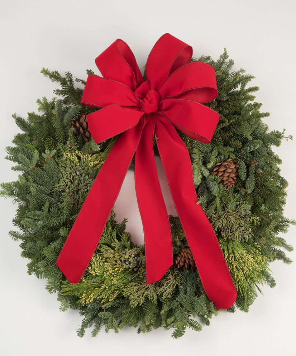A lush Oregon Mixed Wreath adorned with a red bow is the perfect accent to your home. Choose the appropriate size to hang on your door or window and have your house help spread the holiday cheer.