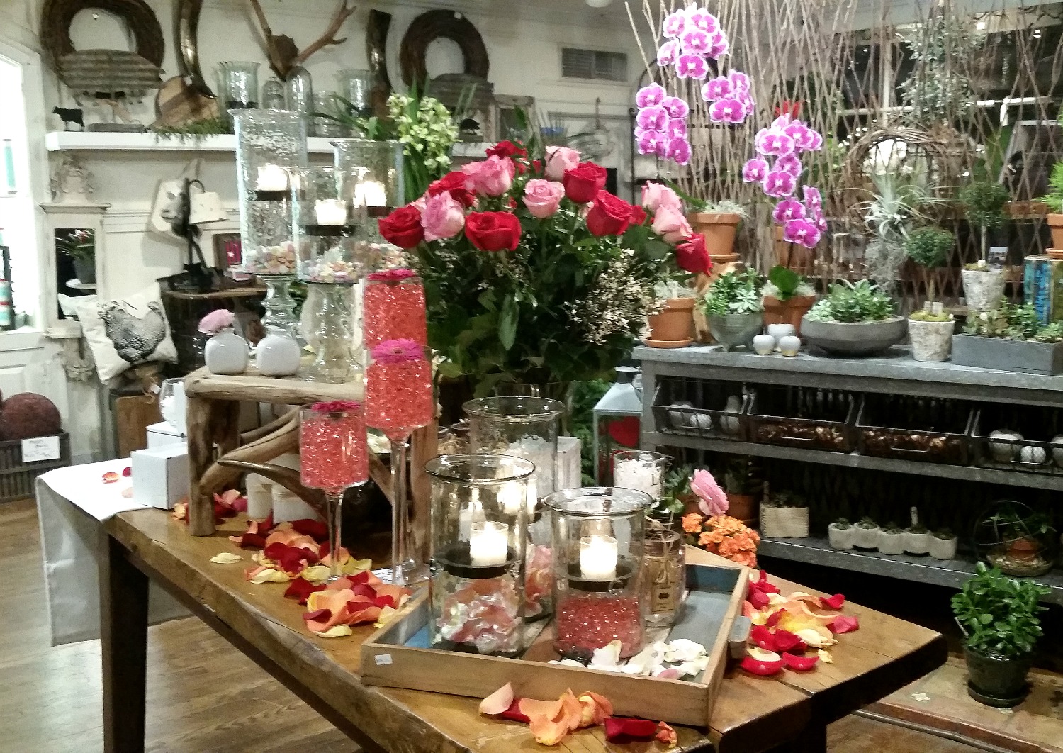 Valentine's day candles, roses and rose petals