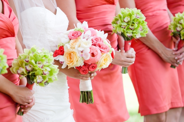 Bridal party with green Cymbidium orchid bouquets
