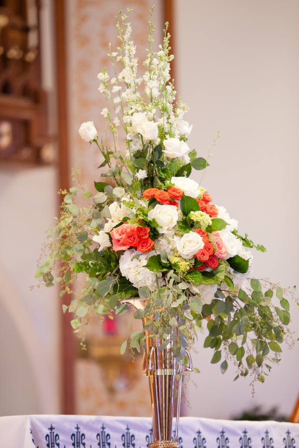 Tall garden style arrangements were designed for the church ceremony
