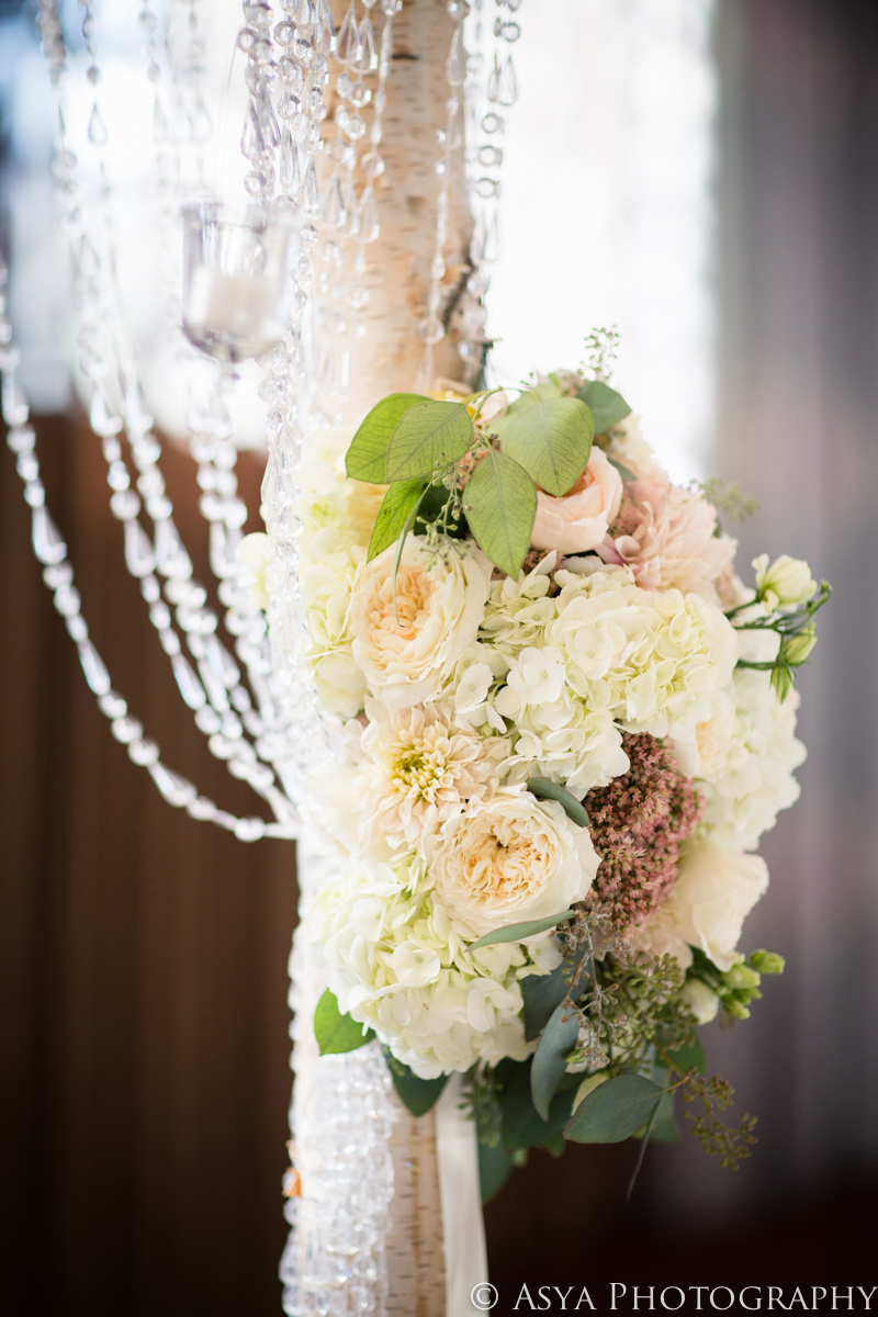 Detail of floral cluster and crystal beading on chuppah posts