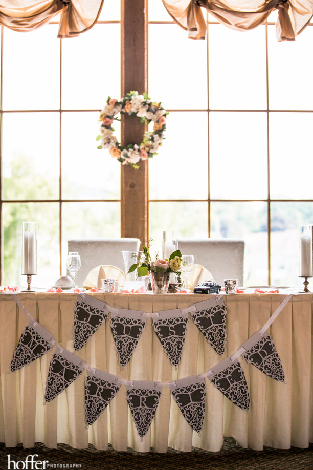 Sweetheart table with a custom pennant banner