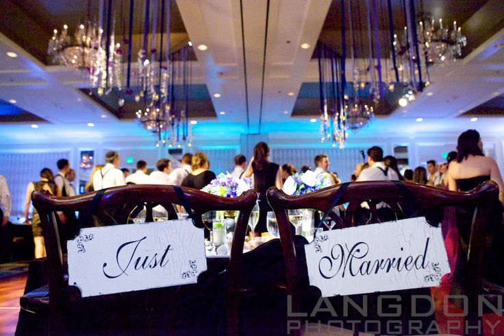Sweetheart table with bride and groom "Just Married" signs