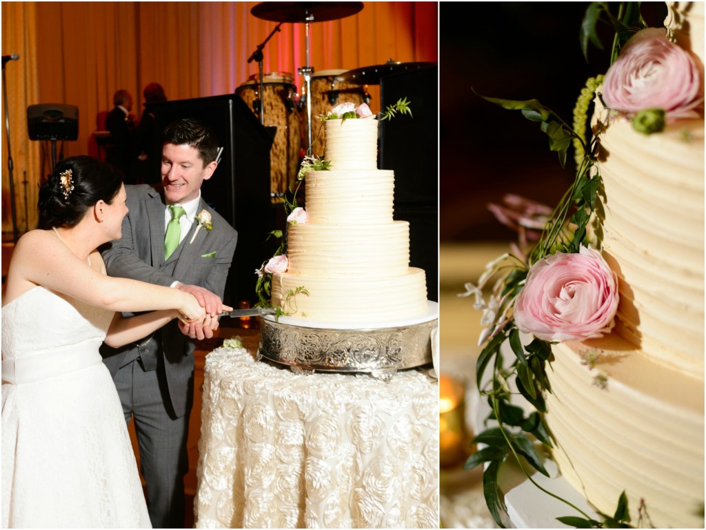 The bride and groom cut the wedding cake.