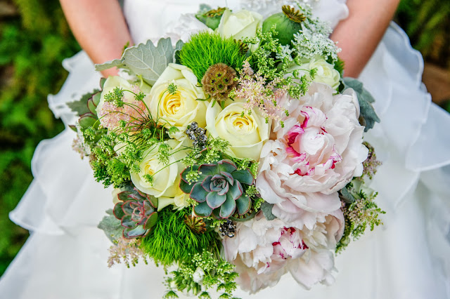A late Spring bouquet featuring soft pink peonies, succulents, yellow roses and hydrangea - a sweet sophistication with some bold textures