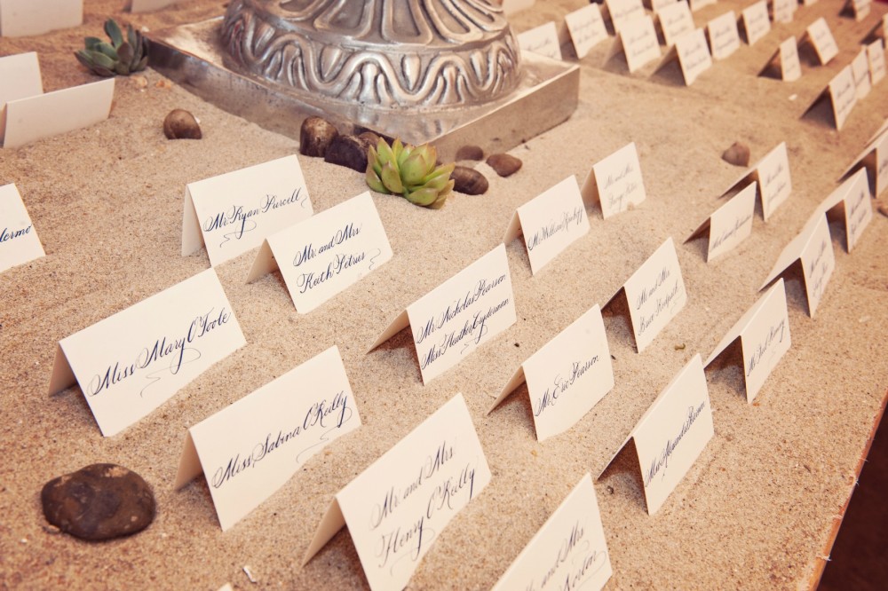 name cards in sand