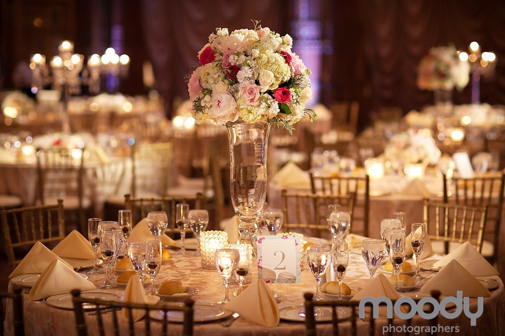 Crystal Tea Room reception with elegant garnier vase of lush white and cream flowers.