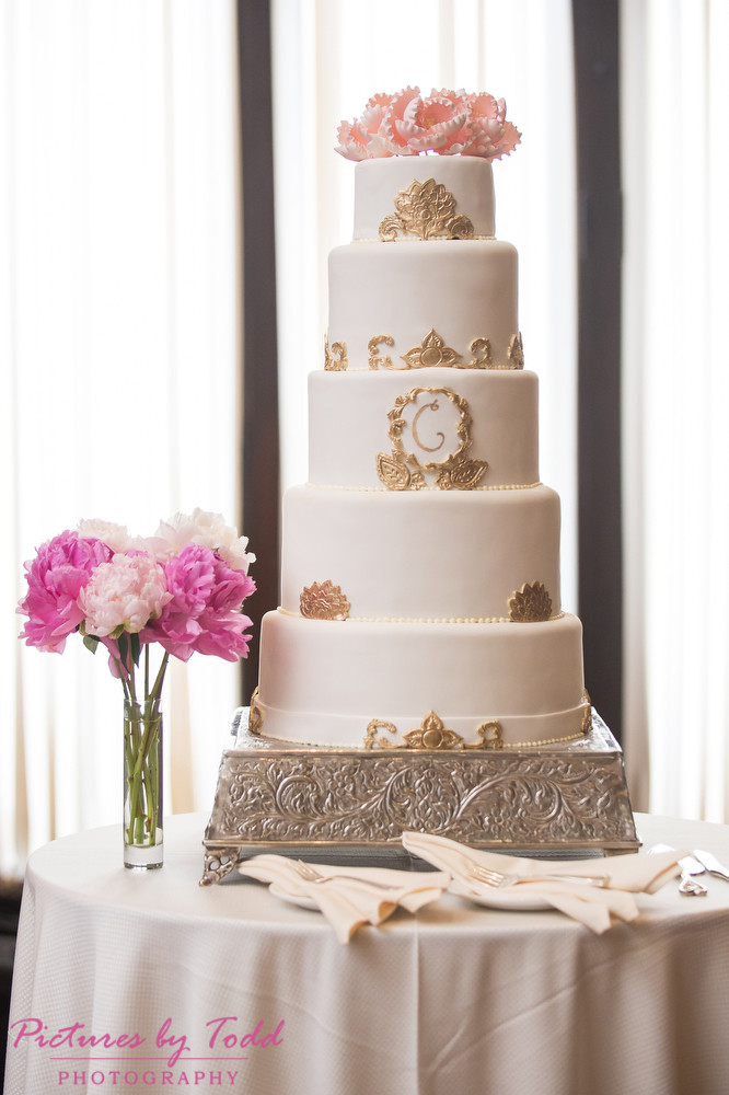 wedding cake with pink peonies