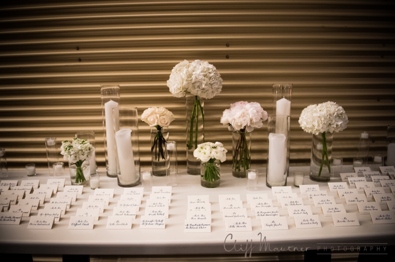 escort card table with flower clusters