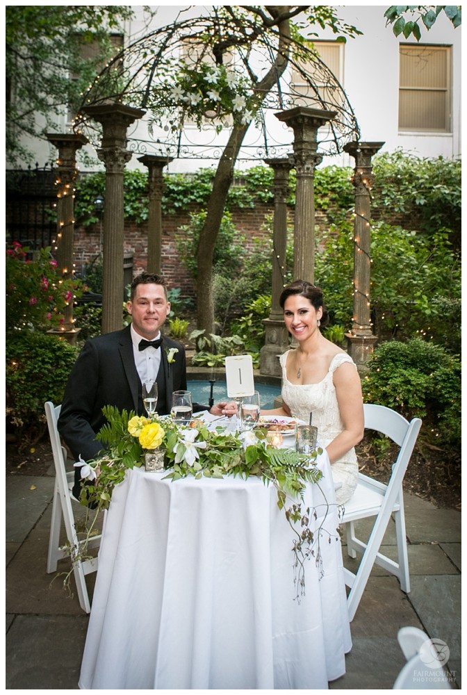 sweetheart table with floral garland
