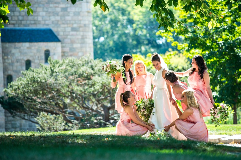 The bridal party helps the bride with her gown - Cairnwood Estate