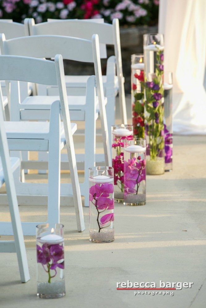 submerged flowers can be designed in various heights and colors, with or without candles, and used throughout the ceremony or reception. 