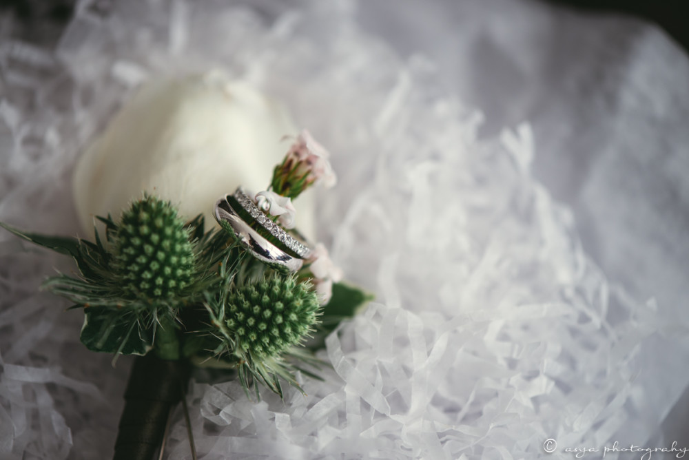 white roses and thistle boutonniere