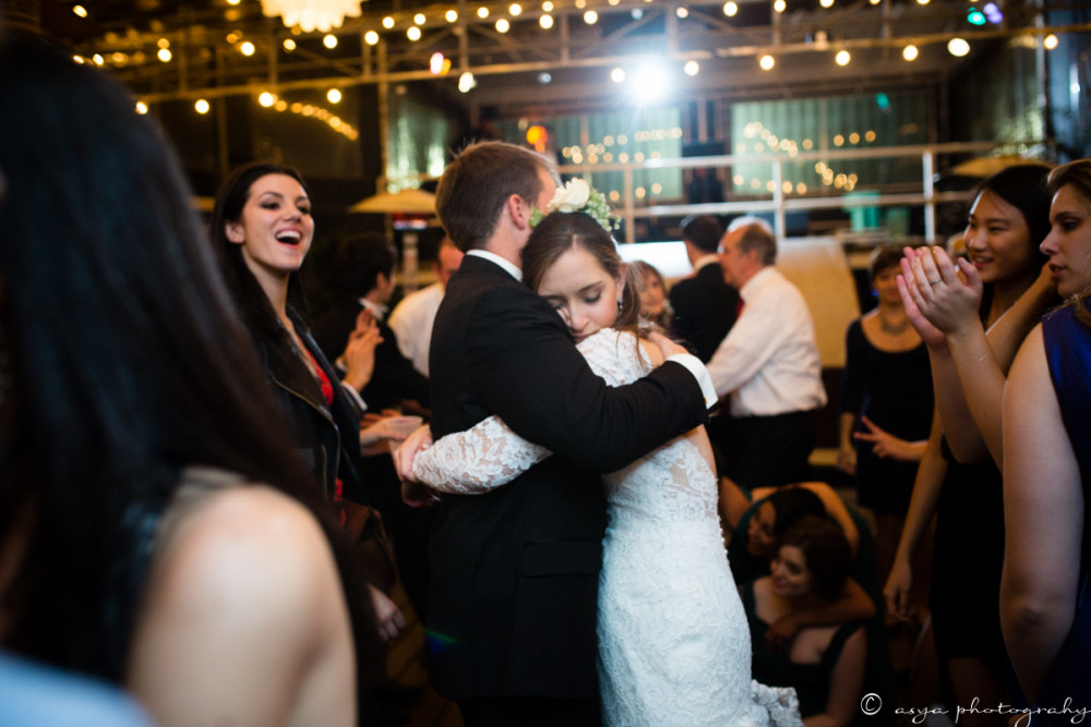 Bride and groom end the night in a sweet embrace