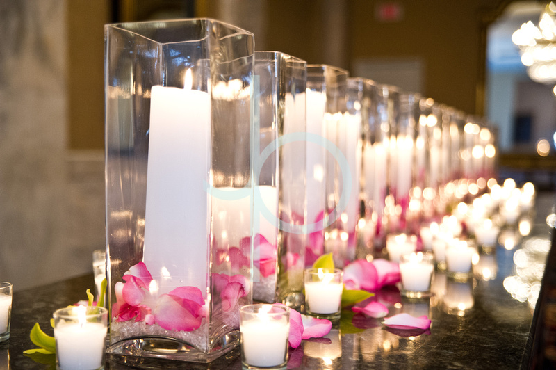 pillar candles with petals and votives