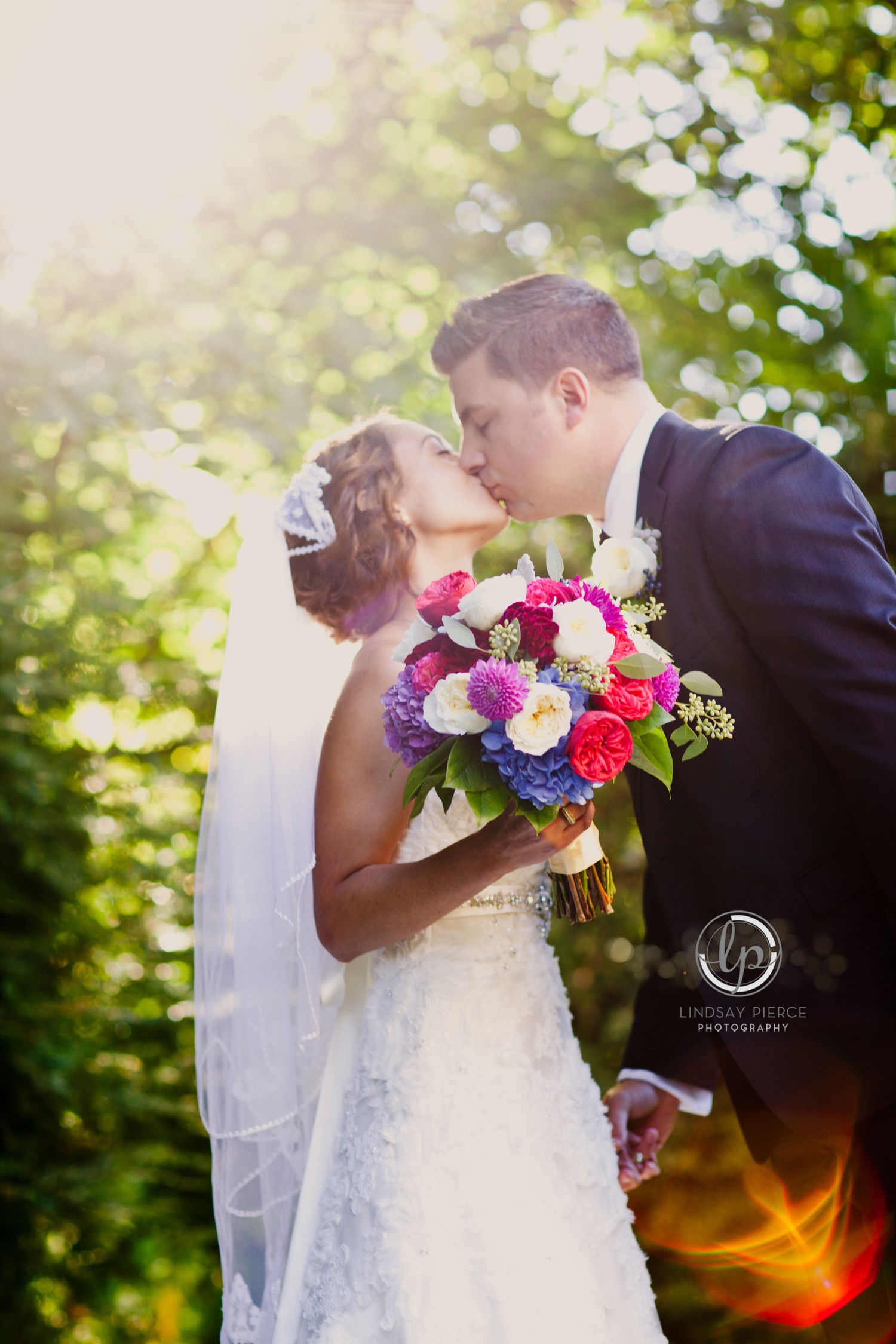 vintage wedding flowers - newly married couple with flower bouquet in hand